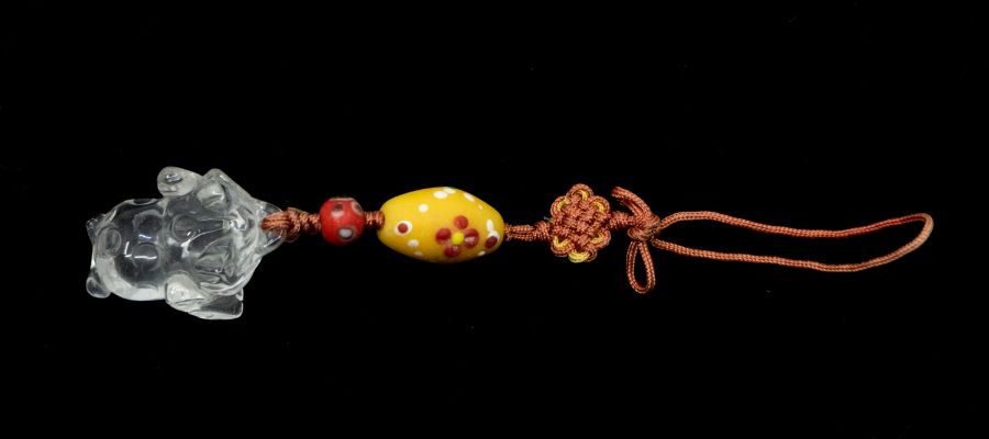 A rock crystal toad and two beads, each decorated with 'eyes', Carthaginian or Phoenician, 4th to