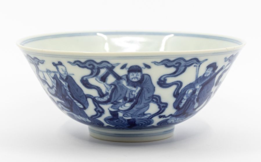 A Chinese blue and white ‘immortals’ bowl, the rounded sides rising from an inverted foot to a