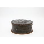 An  Arts and Crafts style circular box and cover, the lid in relief with a ship at sea, applied