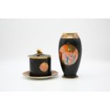 A Carlton Ware 'Moonlight Cameo' pattern preserve jar cover and stand, black ground with orange