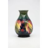 Moorcroft Leaf and Berry on green ground vase, 15.5cms high approx, Moorcroft and Made in England