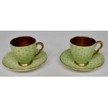 Carlton Ware: A pair of Carlton Ware cups and saucers green ground with orange dots, gilded interior