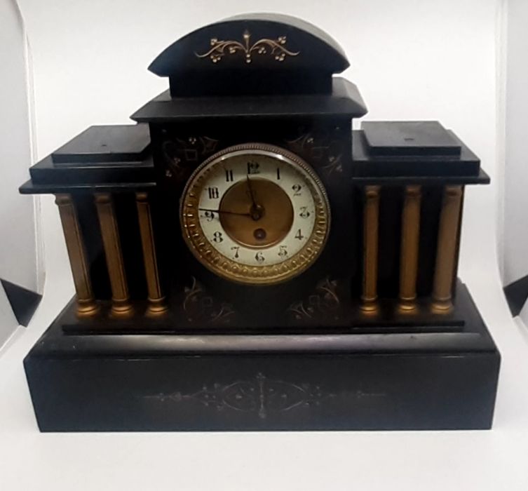 A 19th cent slate mantle clock with French movement