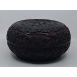 A large Chinese Qing dynasty circular cinnabar box, diameter 28.8cm.