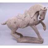 A Tang style earthenware horse sculpture