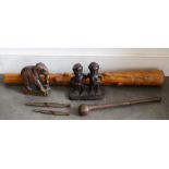 A large tribal club, African figures and carvings