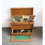 A watchmakers Engineers box with a large collection of watch parts