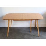 An Ercol light elm kitchen table, (with no extension leaves), H: 72cm, W: 91cm, L:153cm (approx.)