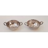 A pair of ornate Hanau silver small twin handled bowls, Hanau psuedo marks for Simon Rosenau (Bad