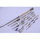 A collection of twenty-four small silver hafred pocket and other button hooks together with al large