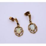 A pair of opal earrings