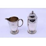 A George V silver sugar sifter and matching cream jug, total approx 10oz