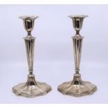 A pair of silver candlesticks