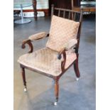 A Victorian armchair with original uphostered seat
