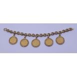 A yellow gold fancy link bracelet suspending three half sovereigns dated 1896, 1925, 1910 and  two