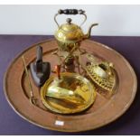 An Arts and crafts style copper circular tray, a Victorian brass kettle on a stand, a metal