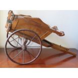 An early 20th century model of a wooden pony trap with metal fittings and spoked metal wheels,