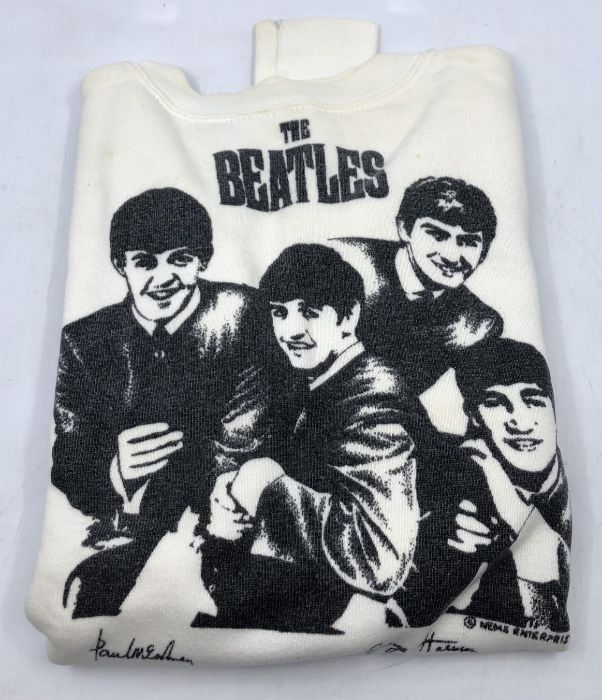 Beatles interest, a cream Beatles jumper together with six Beatles fan club albums comprising: The