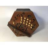 A hexagonal concertina, 30 buttons, leather straps broken, bellows in tact, missing oval makers name