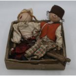 Two jointed and painted wood clothed puppets of a Dutch boy and girl, 28cm long  (2)