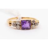 A Edwardian amethyst and diamond 18ct gold dress ring, comprising a central square cut amethyst with