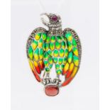 A silver and plique a jour enamel brooch/pendant  in the form of an eagle clasping an oval ruby,