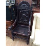 19th Century dark wood carved armchair with Chaucer carved central panel and dragon head arm, turned
