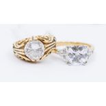 Two 9ct gold and cubic zirconia set dress rings, to include a Victorian style scrolled mount set
