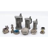 A group of Pewter and white metal, including graduated jugs and covers, pin cushion box and cover