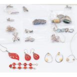 A collection of silver jewellery to include a coral pendant and earrings set, along with a coral set
