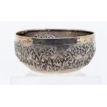 An early 20th Century Indian silver circular bowl, the body chased with figures, cattle amongst