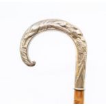 A Victorian style silver topped wooden walking stick, the handle cast as a fox carrying a