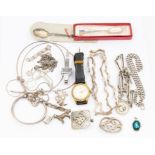 A collection of silver jewellery including a bob watch chain with medallion, necklaces, brooches,