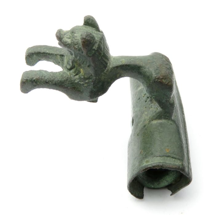 Roman Lion Bow Brooch    Circa, 1st century AD. Copper-alloy, 18.80 g, 30 mm x 29 mm. A well