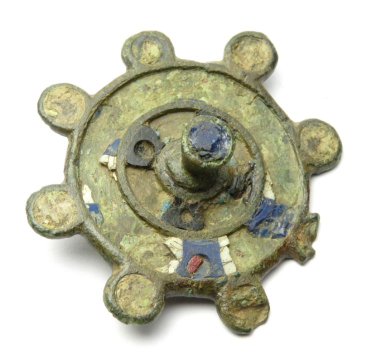 Roman Disc Brooch  Circa, 2nd century AD. Copper-alloy, 40mm, 11.4g. Circular brooch with a raised