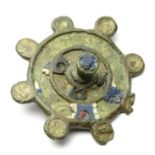 Roman Disc Brooch  Circa, 2nd century AD. Copper-alloy, 40mm, 11.4g. Circular brooch with a raised
