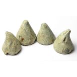 Viking Gaming Pieces  Circa, 10th century AD. A collection of four conical lead gaming pieces used
