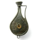 Rare Roman plate brooch in the form of a jug. The jug has a piriform body with a single handle and