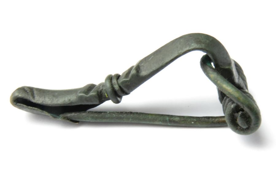 Roman Brooch   Circa, 2nd-3rd century AD. Copper-alloy, 8.32 g, 40.92 mm. A P-shaped bow brooch with
