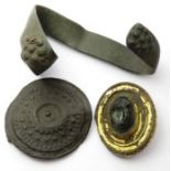 Roman Artefacts  Circa, 2nd-3rd century AD. Brooches, 39 mm & 34 mm. A group consisting of a glass