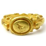 Roman Gold Ring  Circa 2nd century AD. Gold, 22.85 g, 29mm x 25mm; bezel 13mm x 11mm. An