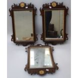 A pair of 19th century mahogany fret framed wall mirrors, each with gilt anthemion detail and