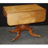 An early Victorian mahogany drop leaf table. The rectangular top over end drawer opposed by false,