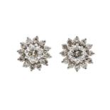 A pair of diamond and 18ct gold cluster earring, comprising a central claw set diamond, each approx.