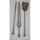 A set of three steel fire irons, shovel and tongs