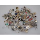 A large quantity of silver and costume earrings