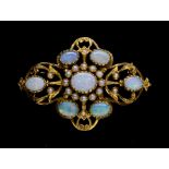 An opal and pearl set 9ct gold brooch, comprising a quatrefoil of open work decoration, each point