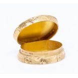 A 9ct gold pill/snuff box, oval form, machine engraved hinged lid with initial J, with scroll and