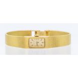 A 9ct gold ladies vintage Tissot quartz  watch, rectangular gold tone dial with applied baton