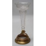 An Edwardian Anglo-Indian brass table centre, the star-cut glass trumpet on coiled snake support and